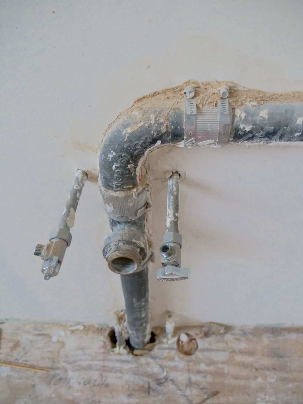 Close-up of an old corroded pipe fitting being replaced