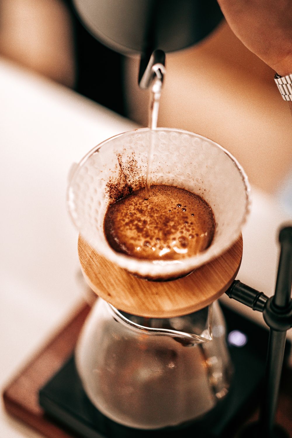 Steam rising from a pour-over coffee mid-brew