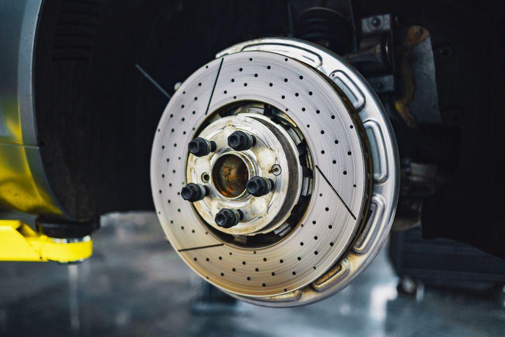New drilled and slotted brake rotor installed on a vehicle