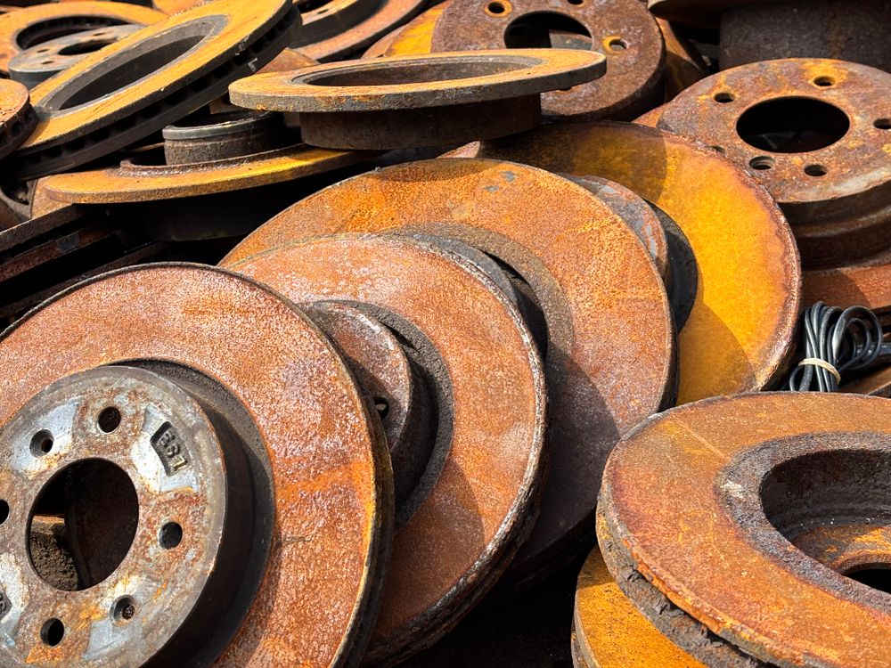Pile of worn, rusted brake rotors