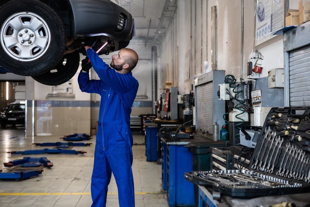 Vehicle raised on a lift for a full multi-point inspection