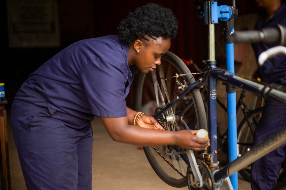 Mechanic working on a bicycle wheel in the repair shop